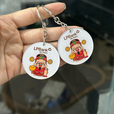 Móc Khóa Nhựa Tròn Hình Thần Tài In Logo Quảng Cáo