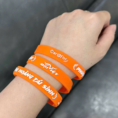 Vòng Tay Cao Su Màu Cam In Logo Sự Kiện Theo Yêu Cầu